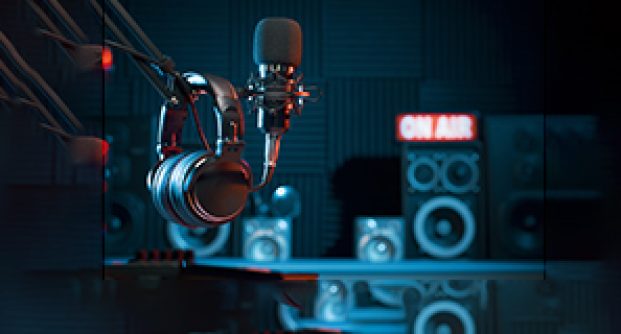 Professional microphone and headphones at the radio station, entertainment and communication concept